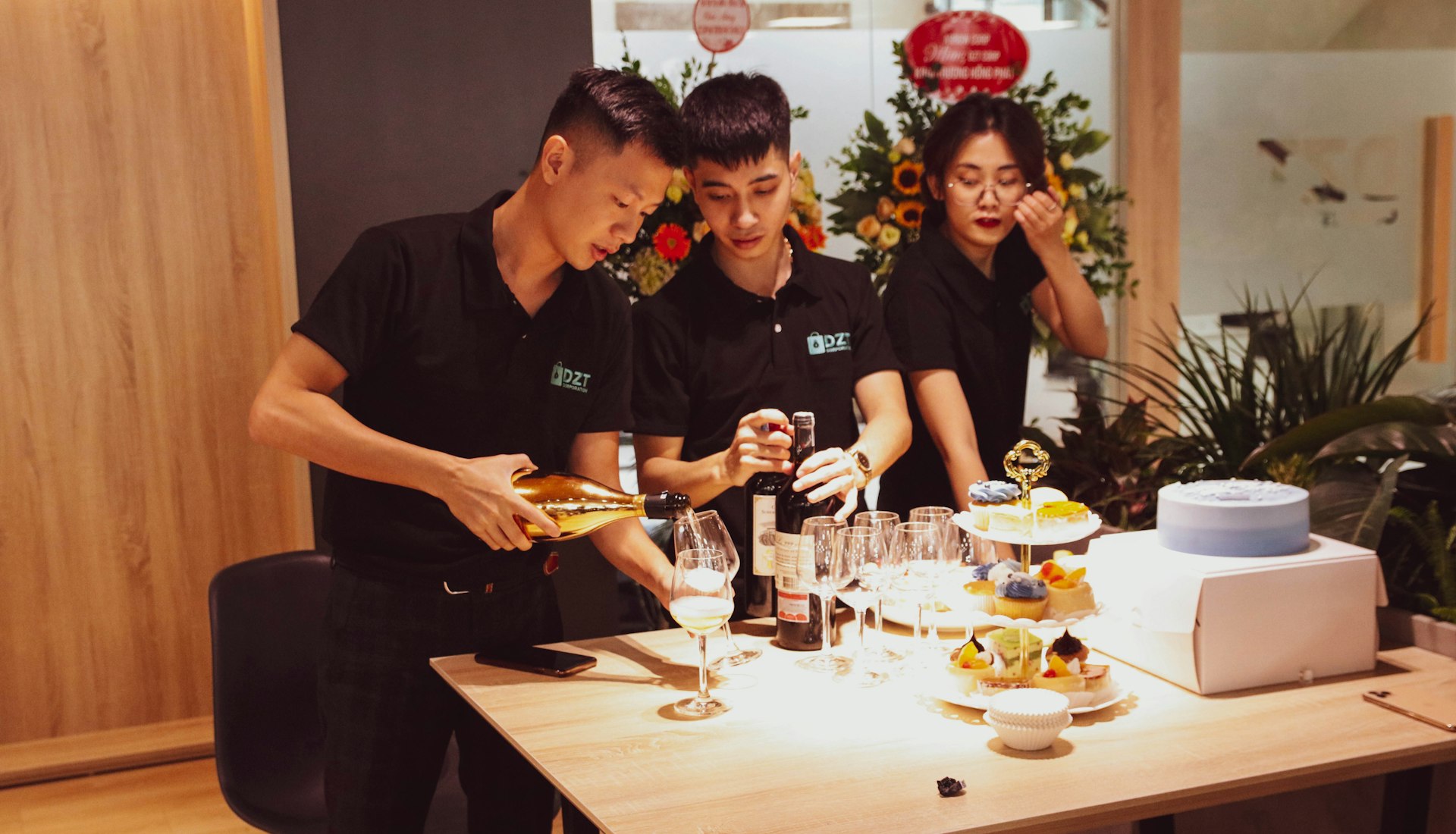 man in black polo shirt sitting beside woman in black shirt
