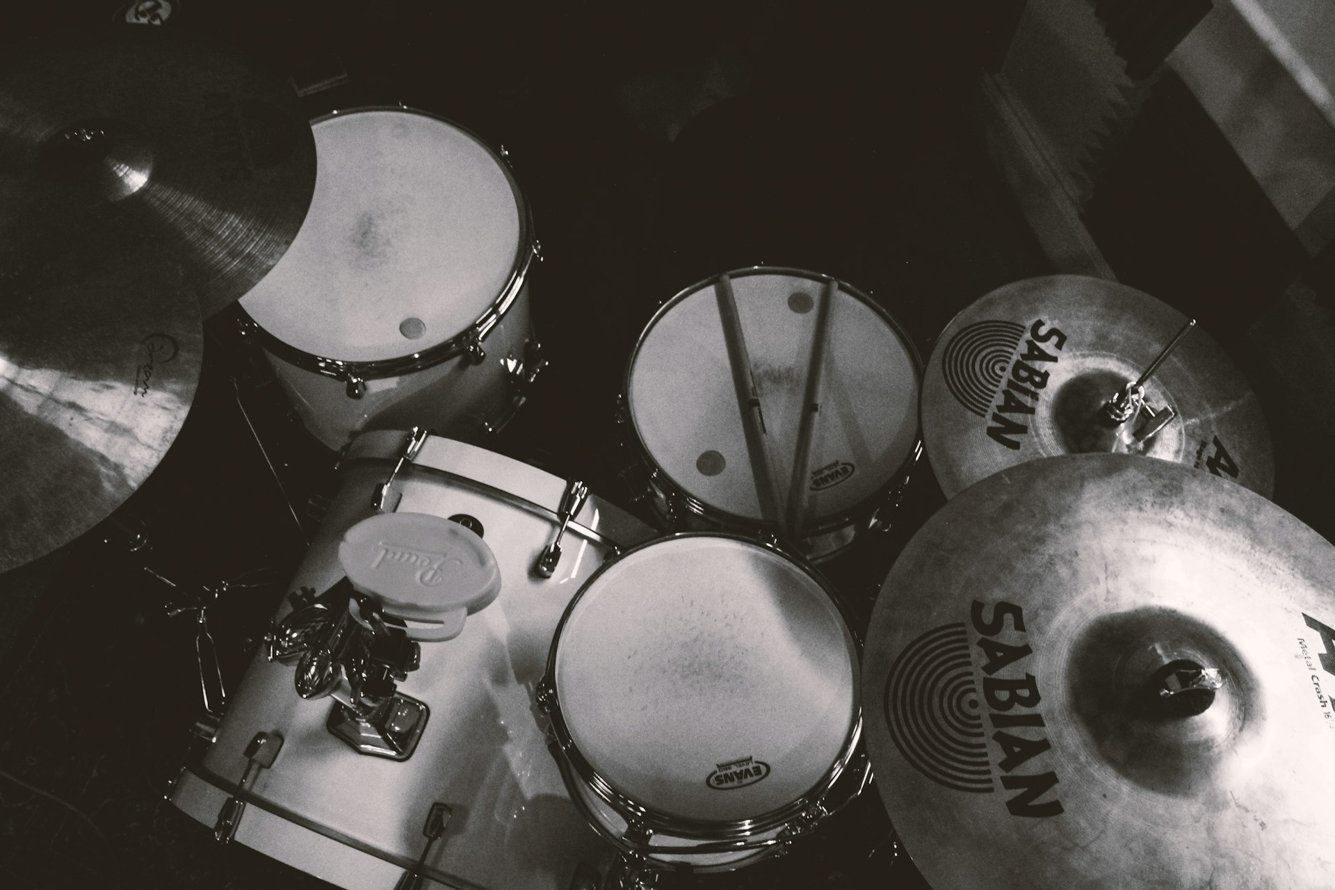a black and white photo of a set of drums