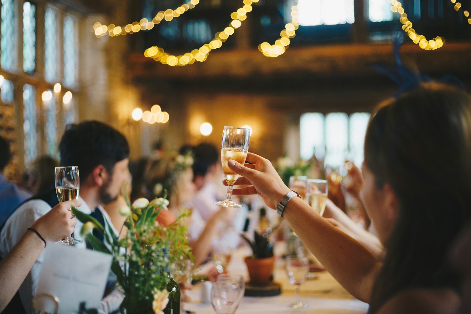 Guests raising glasses at a charity gala