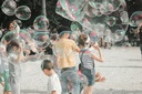 unsplash_k2UQ0DKctl4_kids playing bubbles party