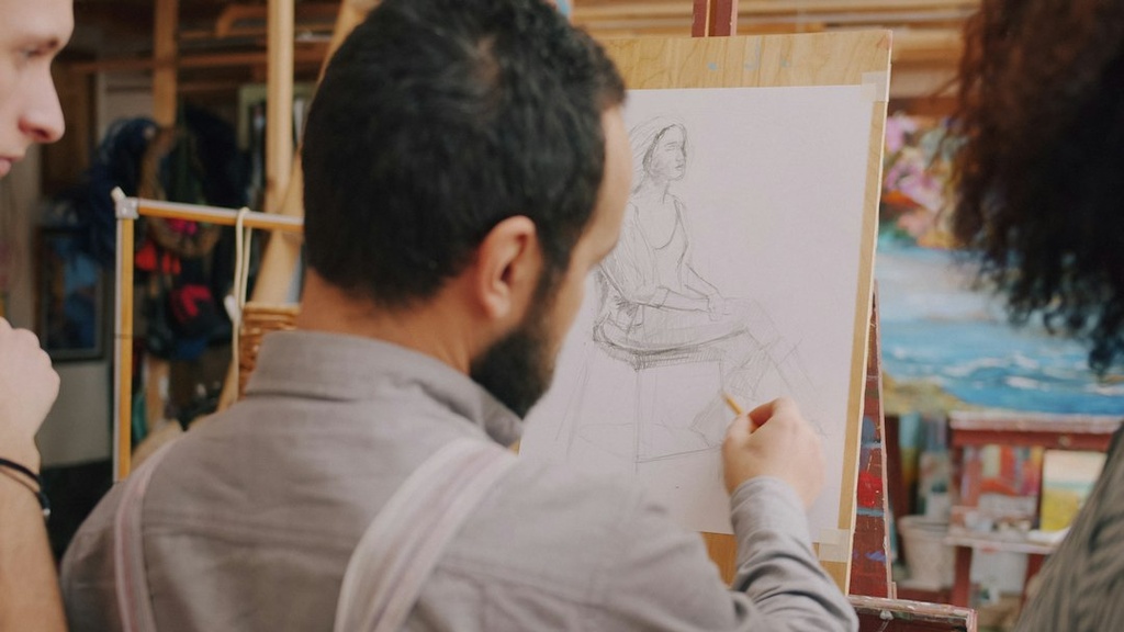 unsplash_61pwguSYg_A_caricature artist sketching