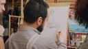 unsplash_61pwguSYg_A_caricature artist sketching